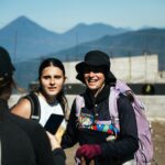 Hikers on Acatenango Volcano, Guatemala, with mountains in the background.