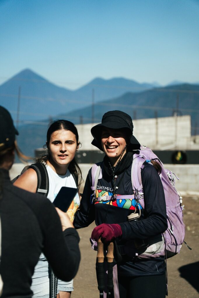 Hikers on Acatenango Volcano, Guatemala, with mountains in the background.