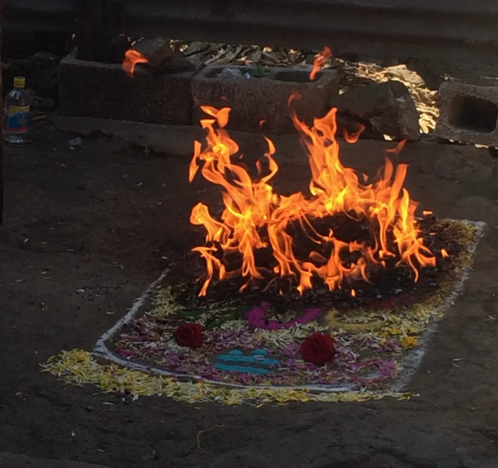 Fire ceremony with flowers and colorful sand patterns on Antigua Legends Tour