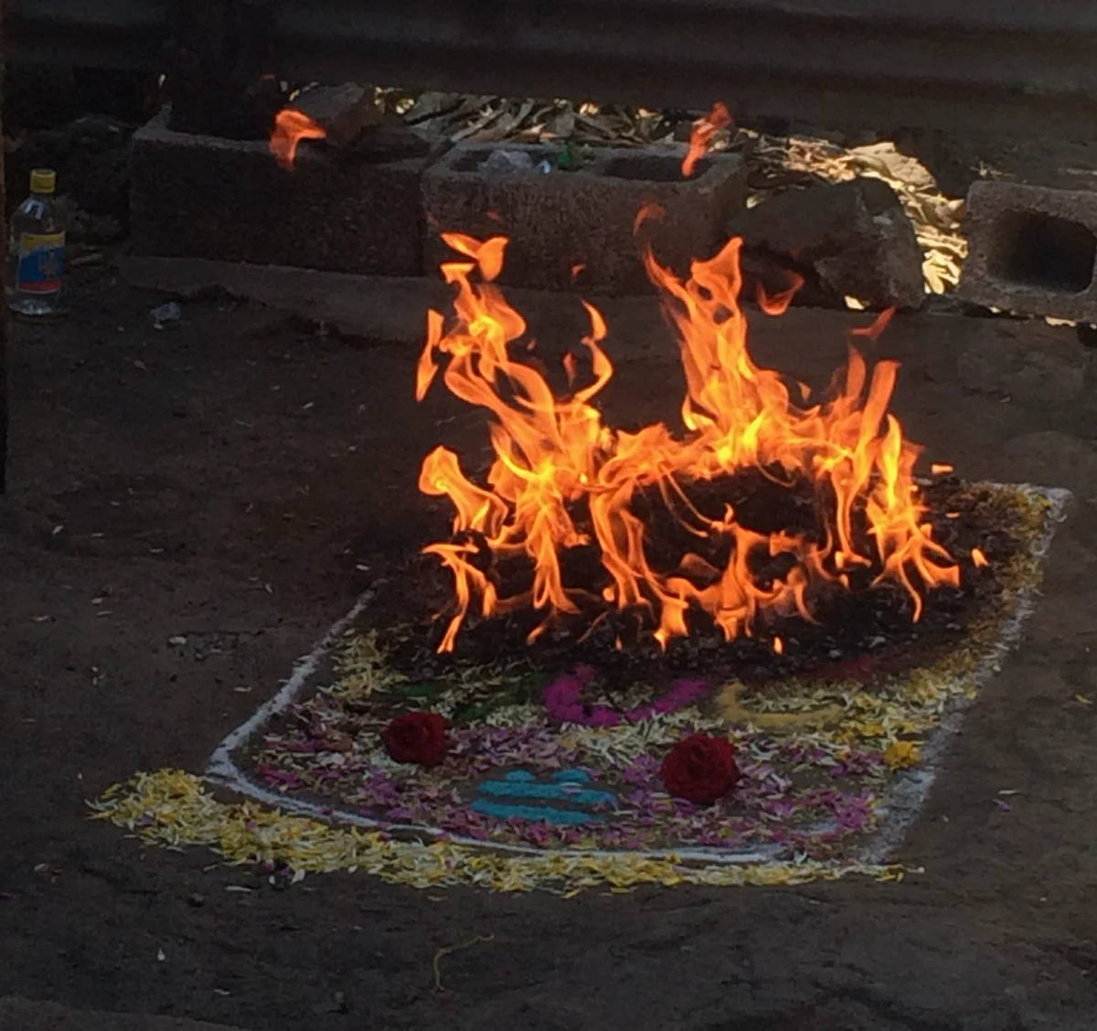 Fire ceremony with flowers and colorful sand patterns on Antigua Legends Tour